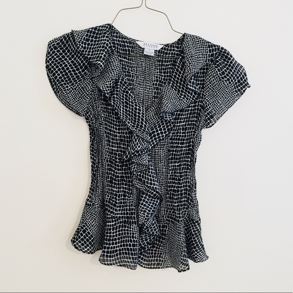 Black and white ruffle shirt.